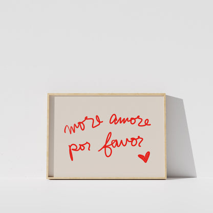a simple, minimalist design with a white background and a wooden frame. The main element is a framed text that reads "More amore por favor?" in a cursive red font.