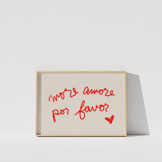 a simple, minimalist design with a white background and a wooden frame. The main element is a framed text that reads "More amore por favor?" in a cursive red font.