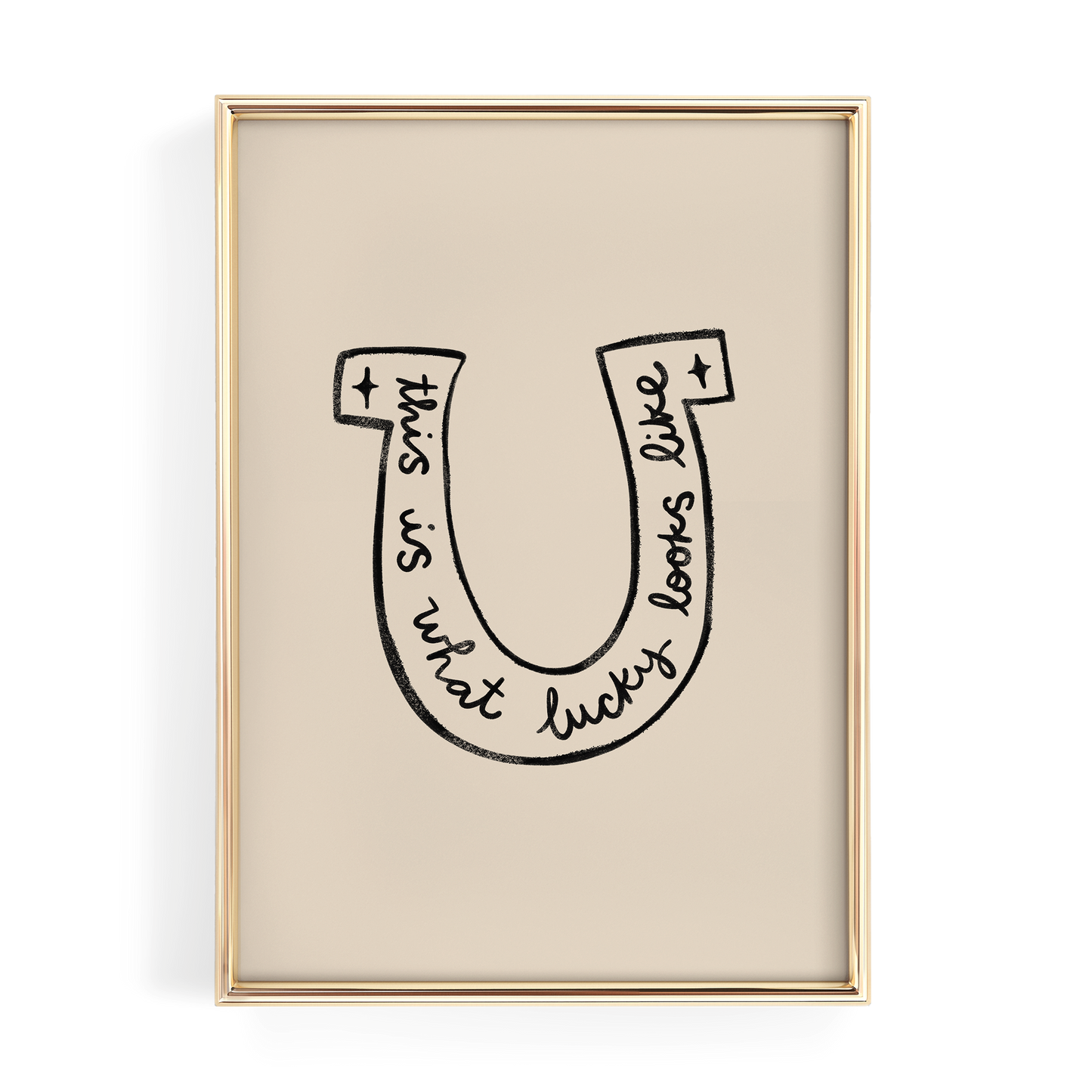 a framed artwork with a stylized letter 'U' containing the text "This is what lucky looks like".