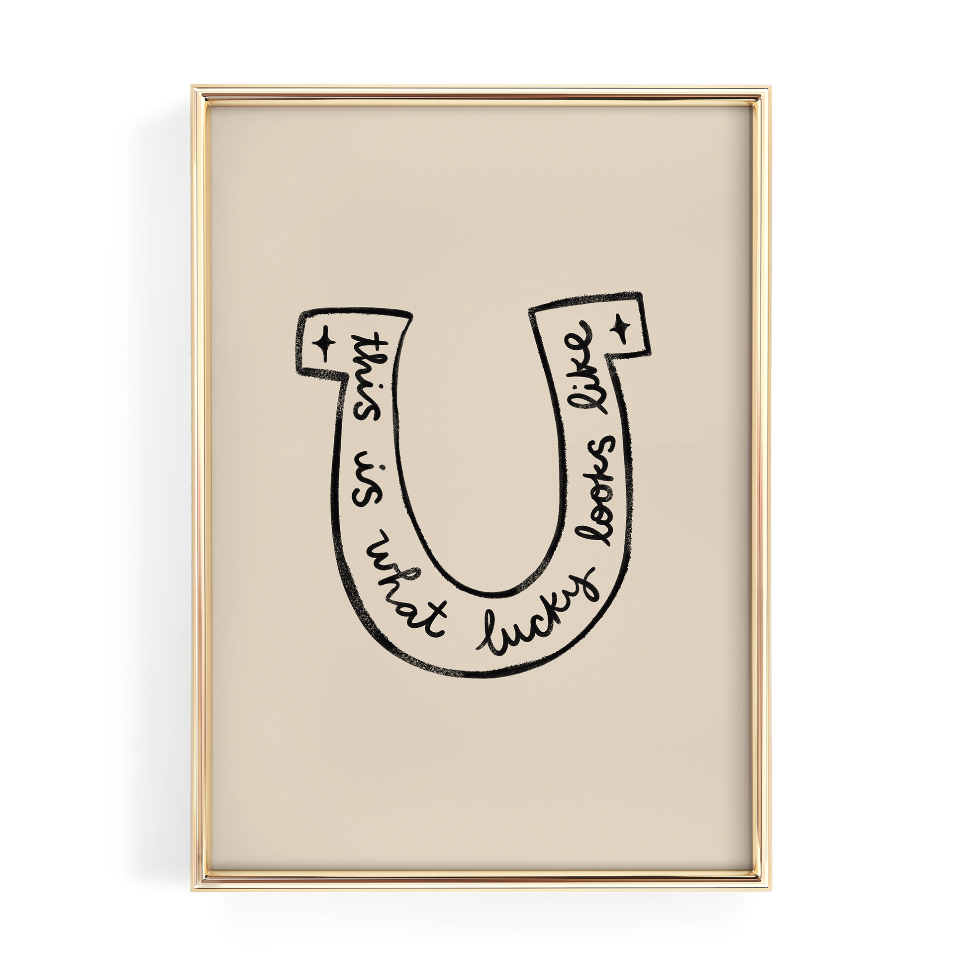 a framed artwork with a stylized letter 'U' containing the text "This is what lucky looks like".