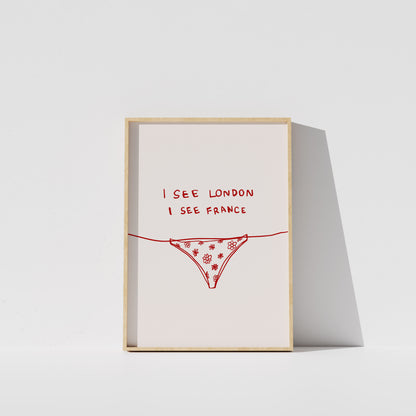 A framed poster with the text "I see London I see France" written on it, along with a simple illustration of a underwear or underwear-like object.