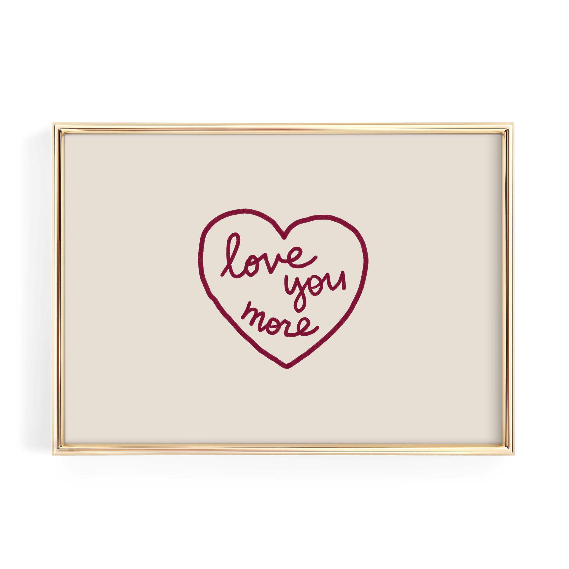 A framed image with a heart-shaped design containing the text "love you more" written in cursive.