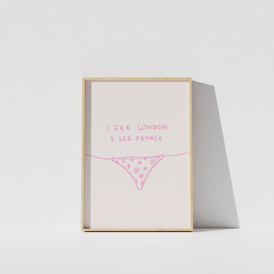 A framed poster with the text "I see London I see France" written on it, along with a simple illustration of a underwear or underwear-like object.