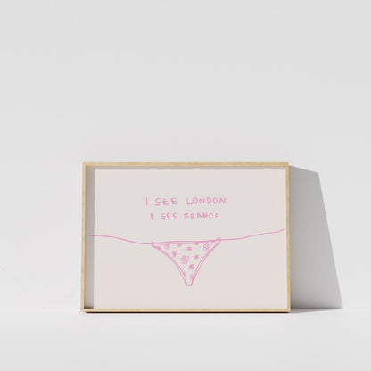 A framed print with the text "I see London I see France" written on it, along with a simple illustration of a underwear or underwear-like object.