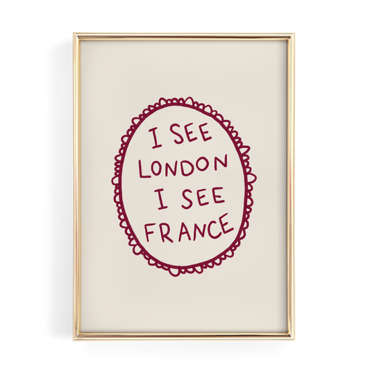 a framed piece of art with the text "I see London I see France" written in a decorative oval frame.