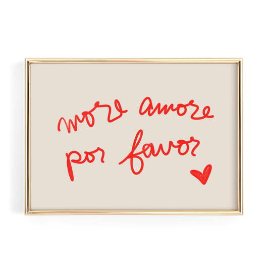 a framed piece of art with the handwritten text "More amore por favor?" and a small red heart symbol.