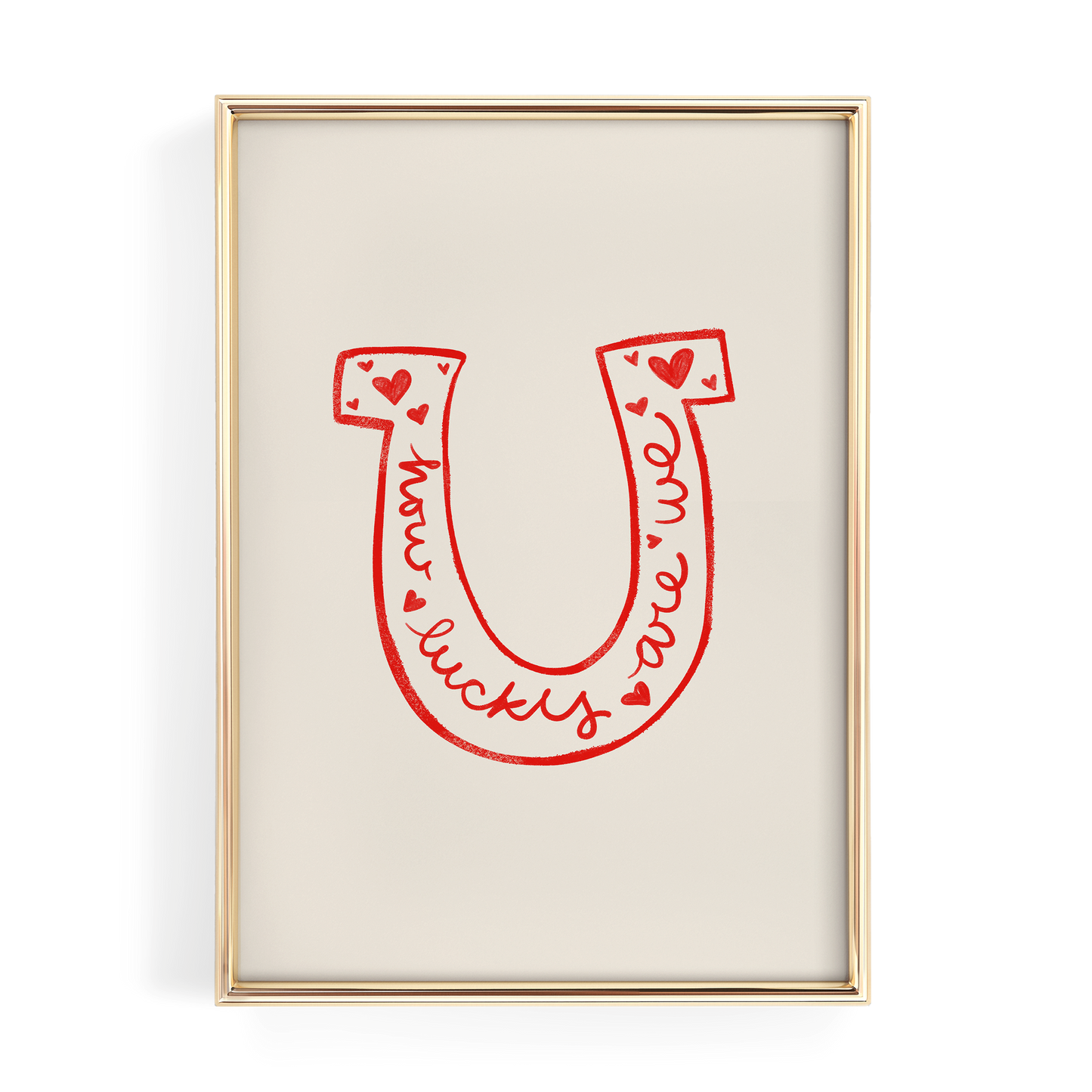 a framed poster with a large red letter "U" and the words "lucky we are" written in cursive script.