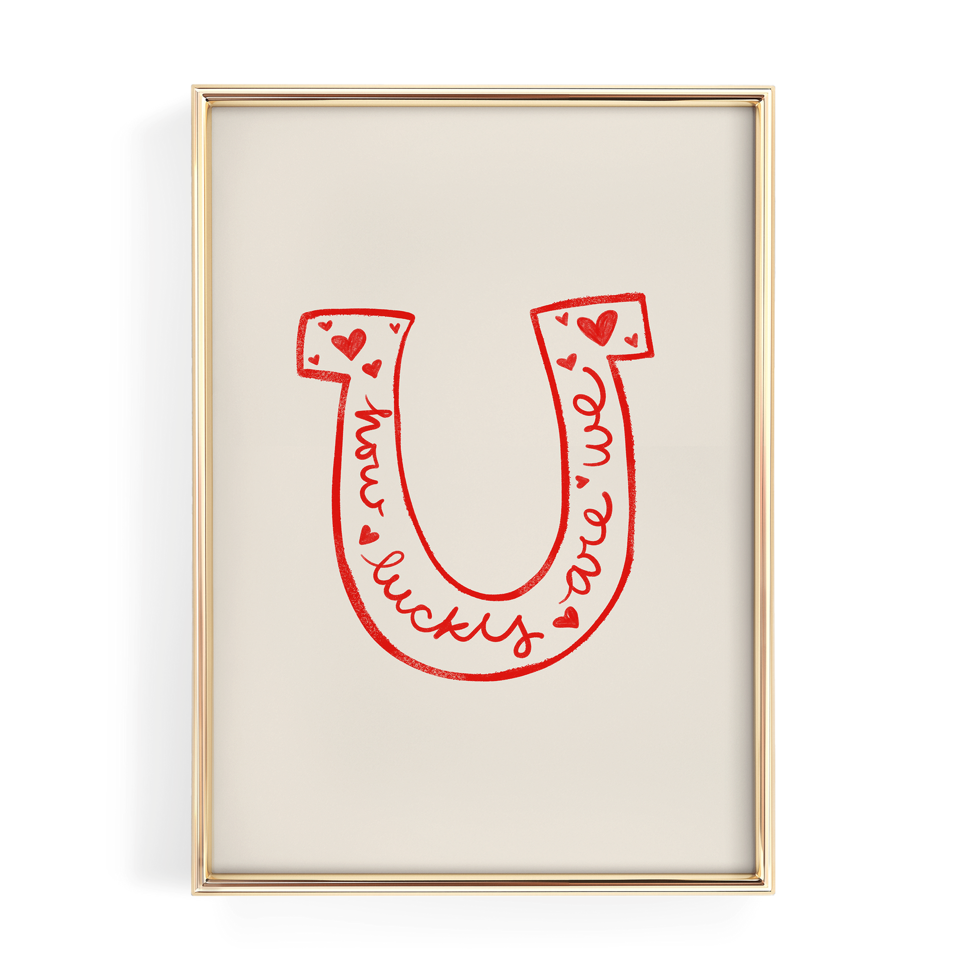 a framed poster with a large red letter "U" and the words "lucky we are" written in cursive script.