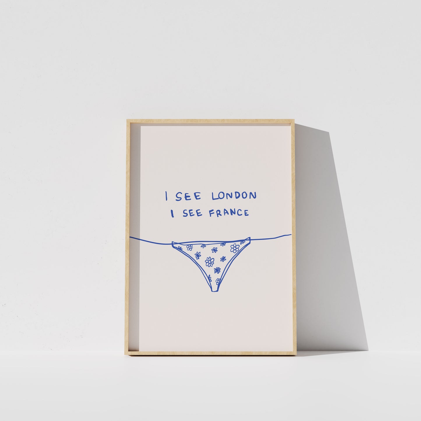 The image is a framed print with a simple design featuring a patterned underwear illustration and the text "I see London I see France" written on it.