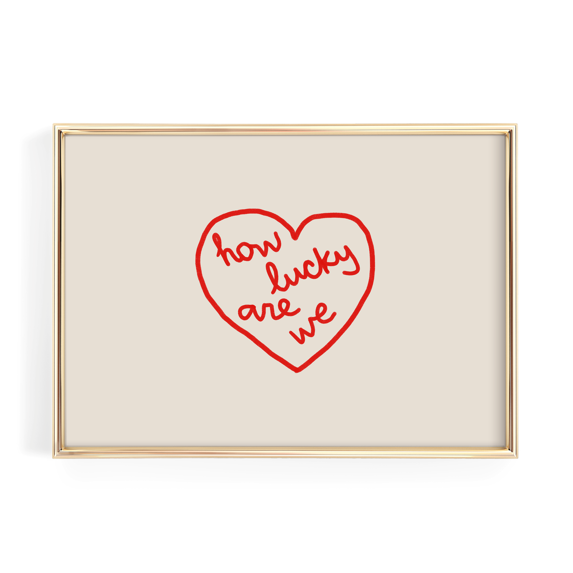 A framed image with a red heart-shaped design containing the text "how lucky are we" written in cursive.