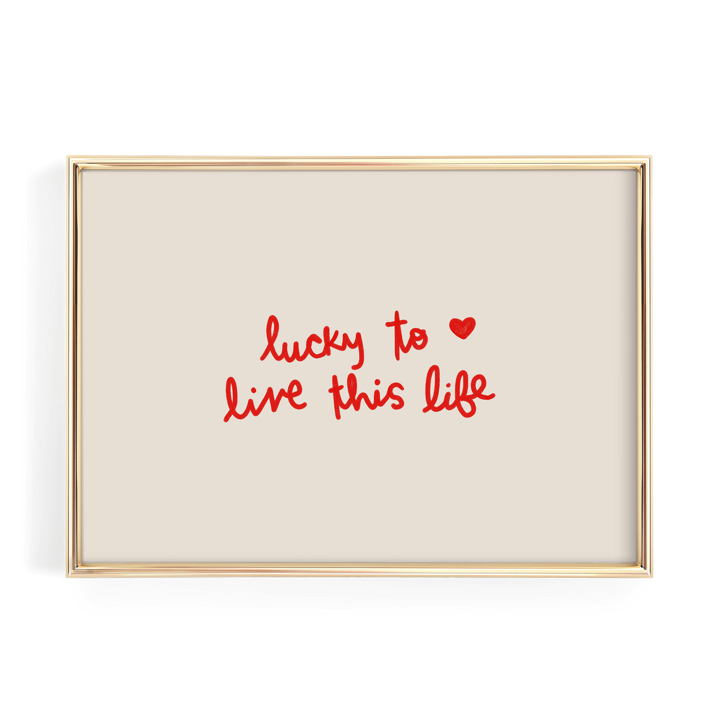 a framed piece of art with the text "lucky to live this life" written in red cursive font.