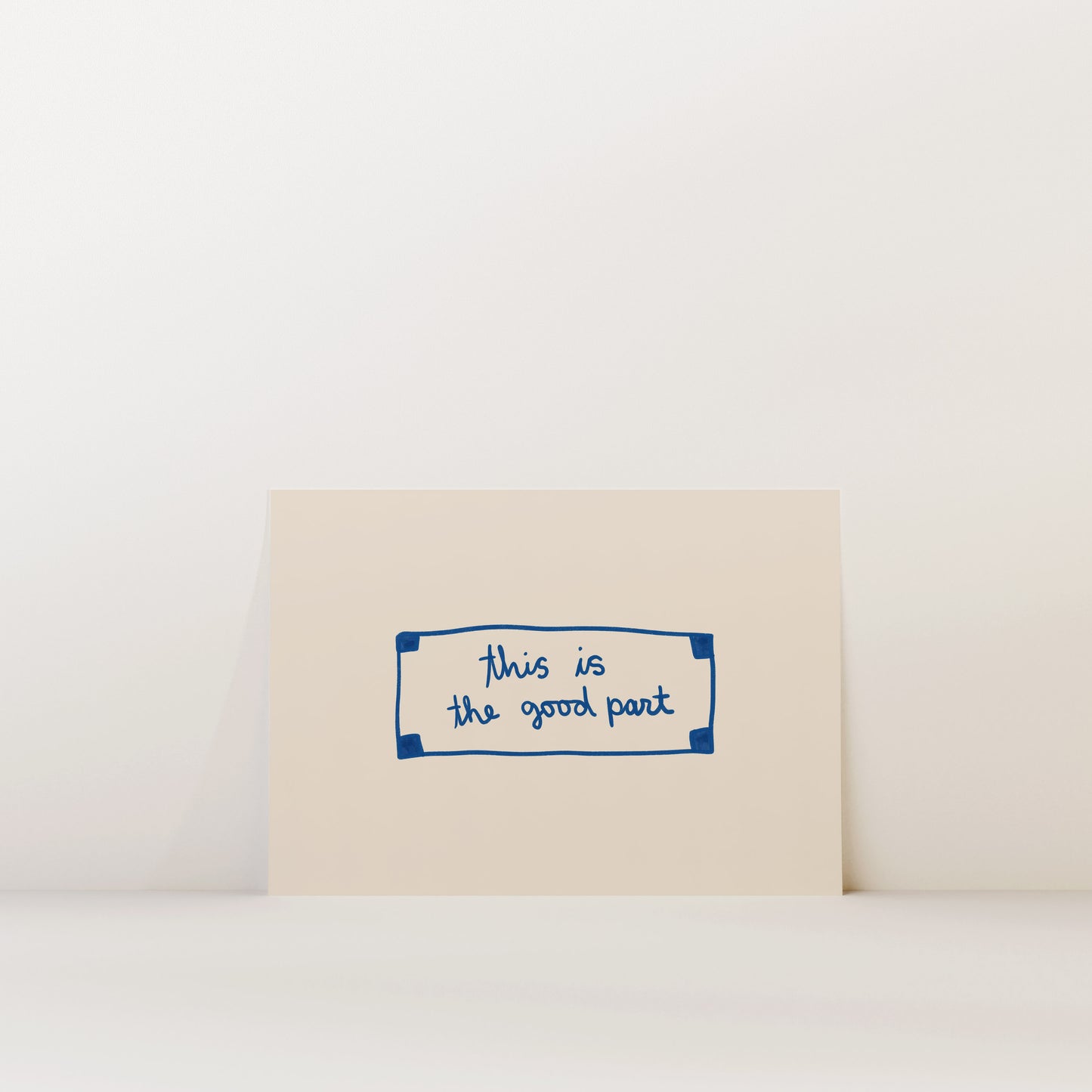 A beige card with a blue border and handwritten text that reads "This is the good part".