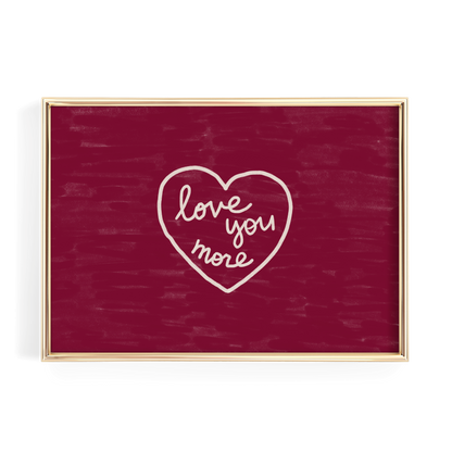 A red square frame with a white heart-shaped text that reads "love you more" inside it.