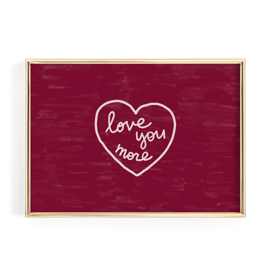 A red square frame with a white heart-shaped text that reads "love you more" inside it.
