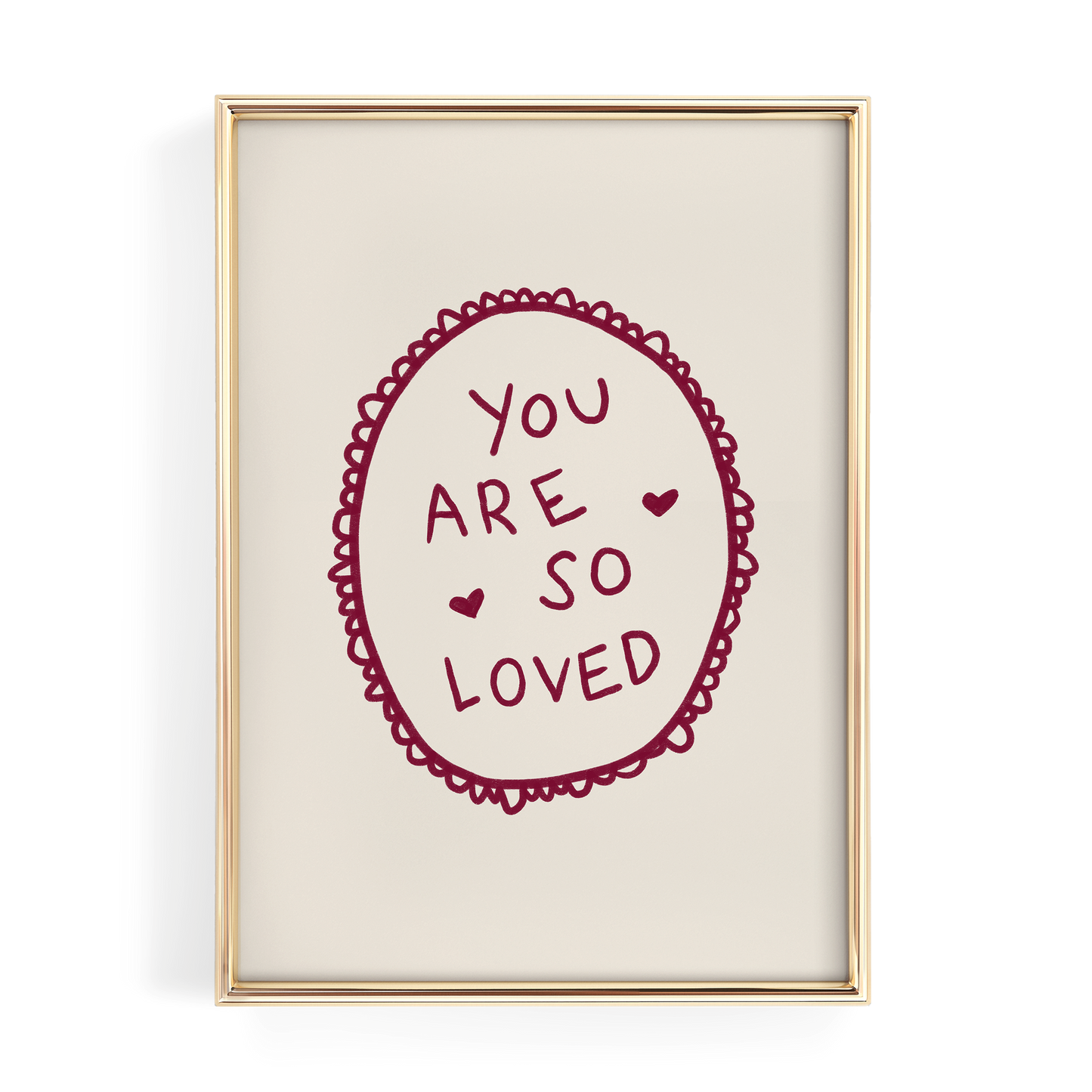 a framed piece of art with a heart-shaped design and the text "YOU ARE SO LOVED" written inside it.
