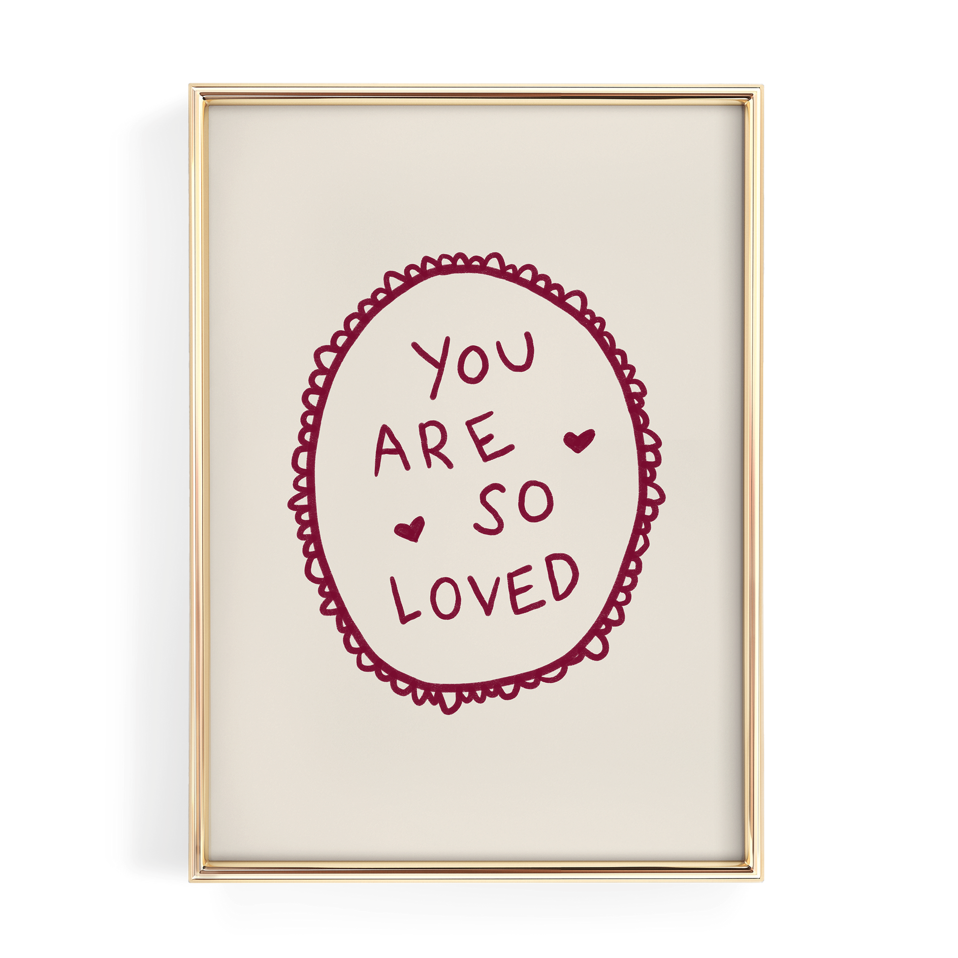 a framed piece of art with a heart-shaped design and the text "YOU ARE SO LOVED" written inside it.