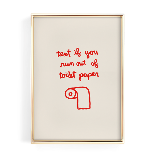a framed piece of art with a humorous text written in red, which reads "text if you run out of toilet paper".