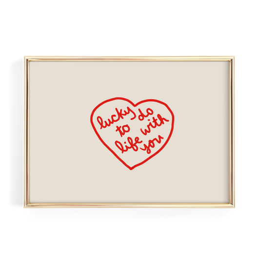 a heart-shaped design with the text "lucky do with life you" written inside it.