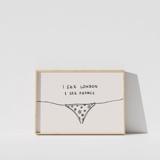 A framed print with a simple line drawing of a bikini bottom and the text "I see London I see France" written on it.