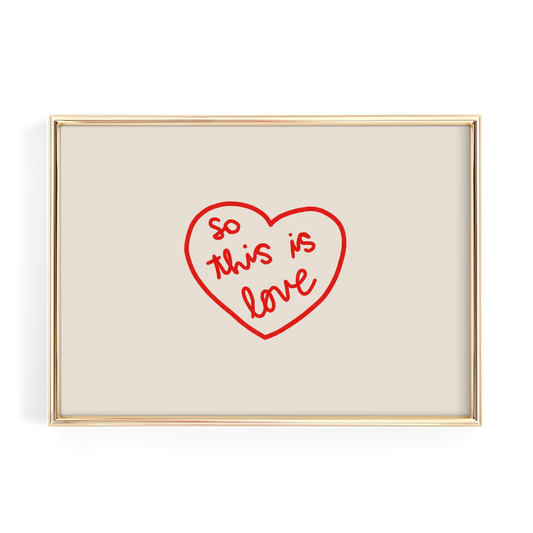 A framed image with a red heart-shaped design containing the text "So this is love" written in cursive.